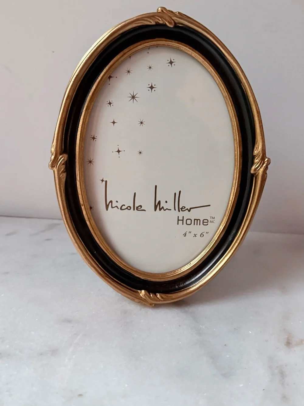 Nicole Miller stylish oval